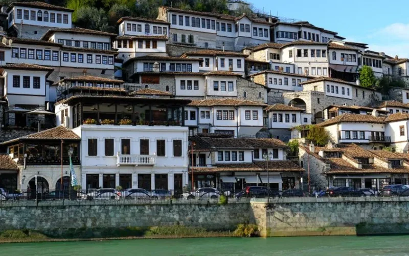 Scenic view of historic Ottoman houses in Berat, Albania, reflecting timeless architectural beauty.