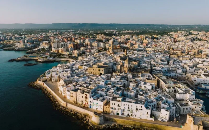 Discover the historic coastal charm of Monopoli with this stunning aerial shot capturing its whitewashed buildings and seaside location.