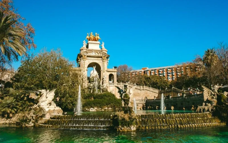 Beautiful view of the monumental fountain in Ciutadella Park, Barcelona with vibrant blue sky.