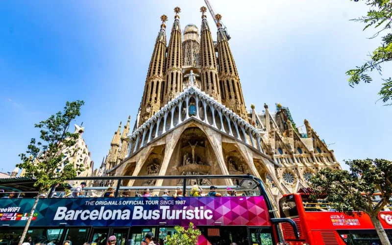 Vibrant scene of tourists at Sagrada Familia in Barcelona, Spain.