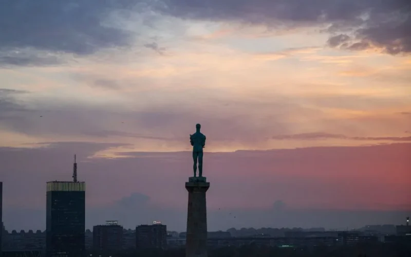 Silhouette of the Pobednik statue on Kalemegdan Fortress at sunset in Belgrade, Serbia.