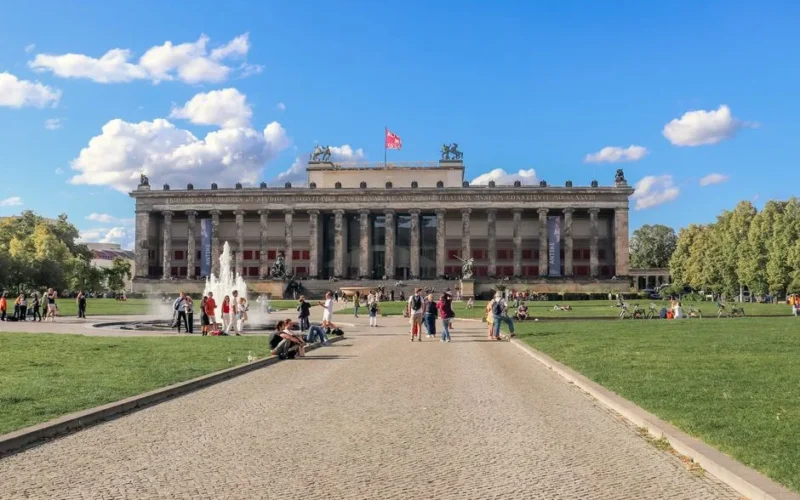 View of the Altes Museum in Berlin with people enjoying the sunny day.