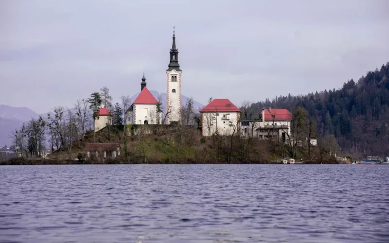 Scenic view of Bled Island with the church and Bell Tower on Lake Bled, Slovenia.