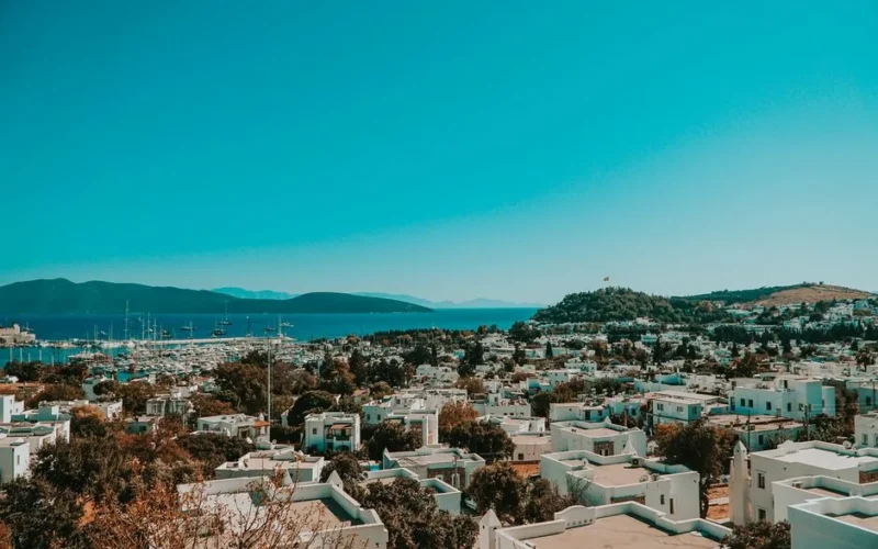 Explore the picturesque Bodrum cityscape with whitewashed buildings and the serene Aegean Sea in the backdrop.