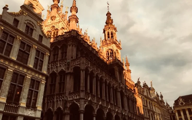 Beautiful view of the historic Grand Place in Brussels during golden hour.