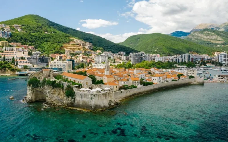 Scenic aerial shot of Budva's historic Old Town along the Adriatic coast.