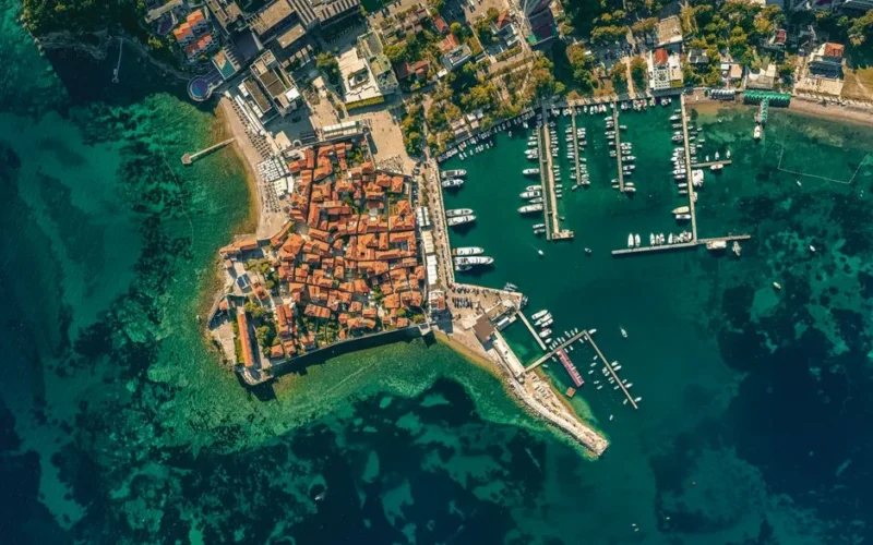 Stunning overhead view of Budva, Montenegro's historic coastal area and marina.