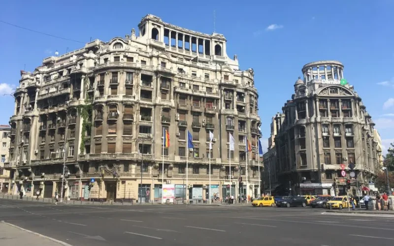 Classic architecture of historic buildings on a sunny day in Bucharest, Romania.