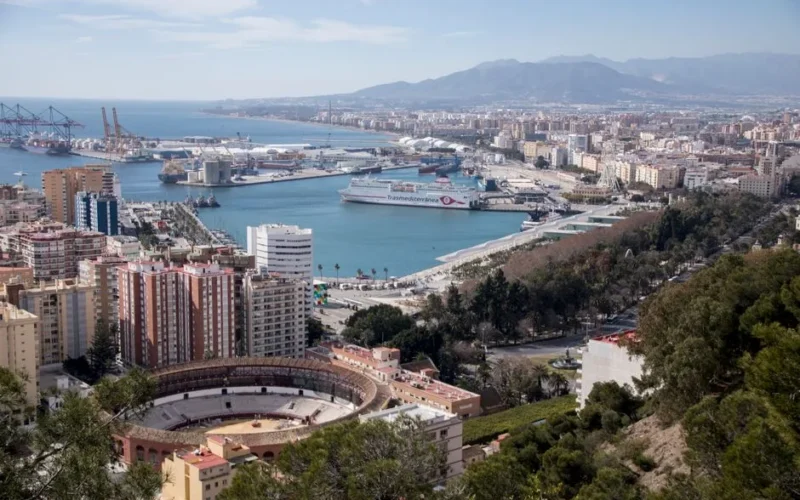 Stunning aerial view of Málaga, Spain, showcasing the port and coastline.