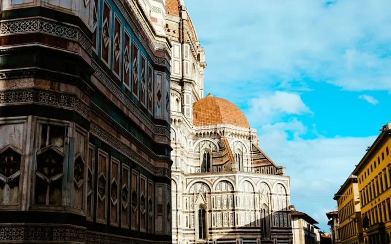A captivating view of the Florence Cathedral's dome under a clear blue sky in Italy.