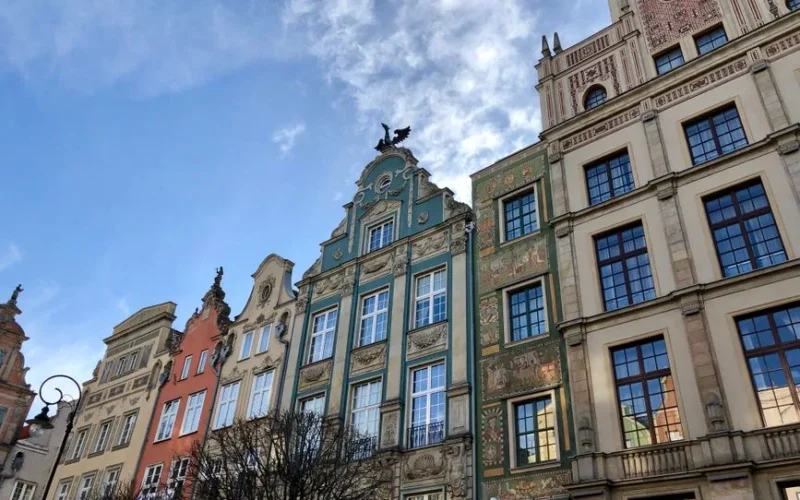 Ornate historic facades in Gdańsk's old town under a clear sky.