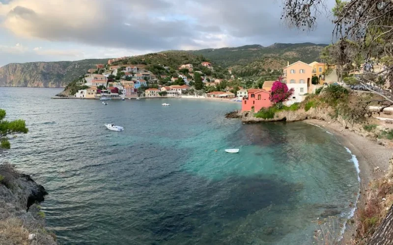 A picturesque view of Asos village in Greece, featuring vibrant houses along the serene coastline.
