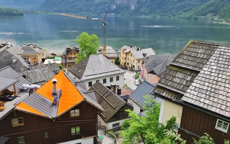 Picturesque Hallstatt village with lake and mountains, ideal for travel imagery.