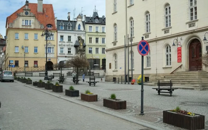 Quaint European town square featuring historic architecture and cobblestone streets, perfect for travel imagery.