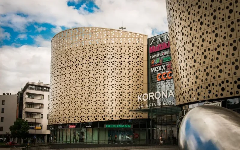A contemporary shopping mall, Galeria Korona in Kielce, featuring unique architectural design.