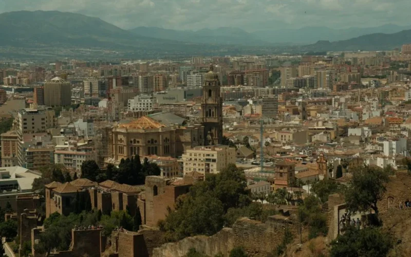 Explore the historic architecture and cityscape of Malaga, Spain.
