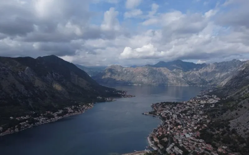 Stunning aerial shot of Kotor Bay with mountains and coastal towns in Montenegro.