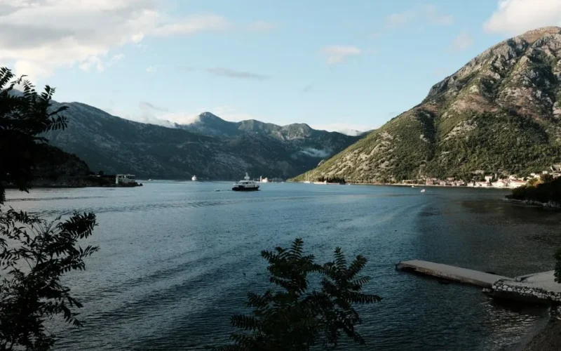 Captivating landscape of Kotor Bay with mountains and clear blue waters, perfect for travel enthusiasts.