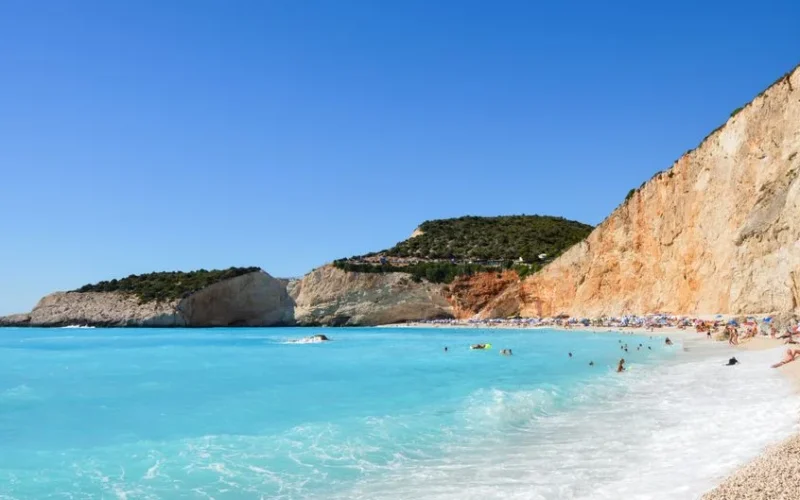 Enjoy the stunning cliffs and turquoise waters of Egremni Beach, Greece, perfect for a summer getaway.
