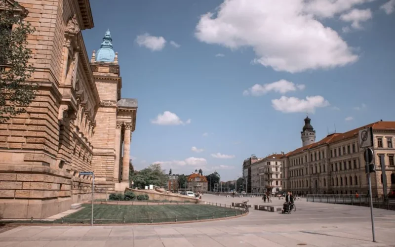 Explore Leipzig's historic architecture in Germany with clear blue skies and classic buildings.