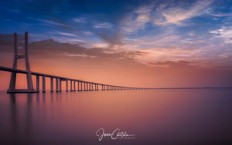 500px provided description: <a href="www.facebook.com/joaocautelafotografo/"> Facebook </a> <a href="www.instagram.com/joao_cautela/"> Instagram </a> [#sunrise ,#bridge ,#lisboa ,#rio ,#ponte ,#expo ,#tejo ,#vascodagama ,#riotejo ,#pontevascodagama]