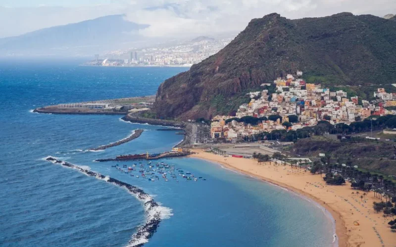 Stunning aerial view of Playa de las Teresitas with mountains and ocean in San Andrés, Tenerife.