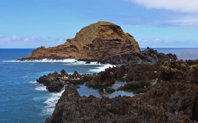 Breathtaking view of natural pools and rocky coastline in Porto Moniz, Madeira.