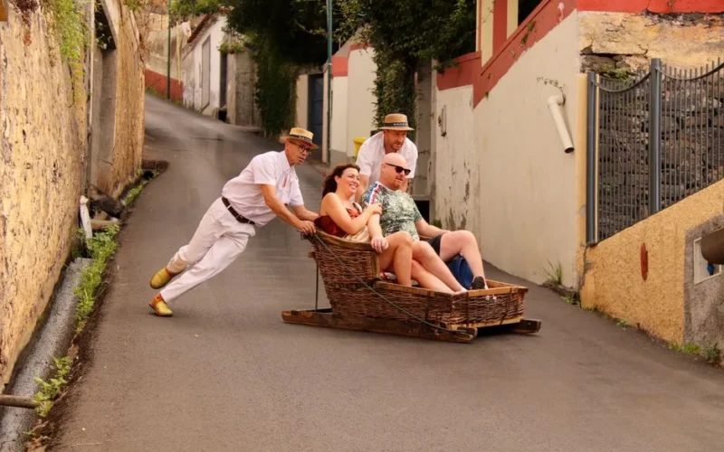 Experience the thrilling traditional wicker toboggan ride down Funchal's steep streets in Madeira, Portugal.
