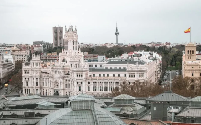 Captivating aerial view of the iconic Palacio de Cibeles and Madrid cityscape, Spain.