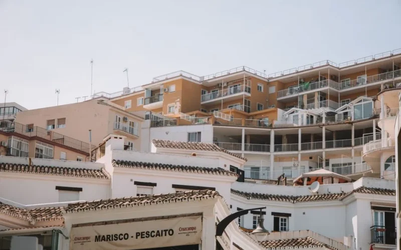 Low angle view of residential buildings and balconies in Málaga, Spain.