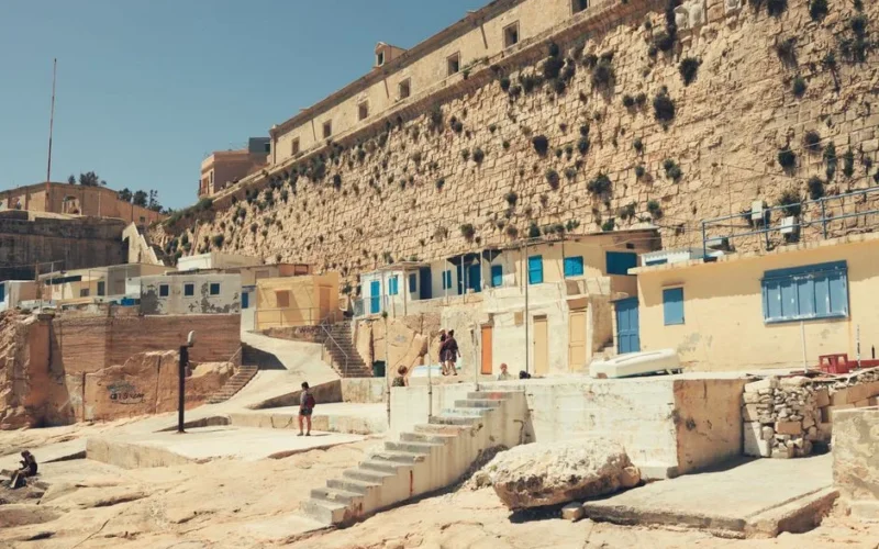 Explore the sunlit stone architecture of Valletta, Malta, showcasing historic urban charm and vibrant Mediterranean culture.