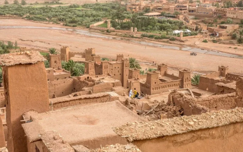 Explore the ancient Moroccan kasbah amid a stunning desert oasis. Ideal travel destination for history enthusiasts.