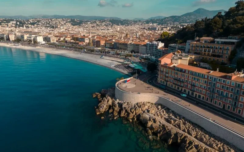 Stunning aerial view of Nice's coastal cityscape along the Mediterranean Sea.