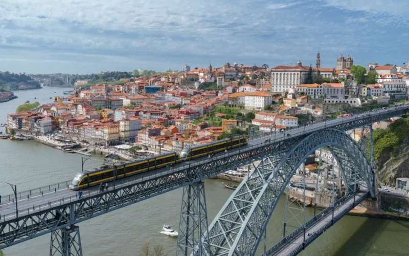 Stunning aerial shot of the iconic Luís I Bridge spanning the Douro River in Porto, Portugal.