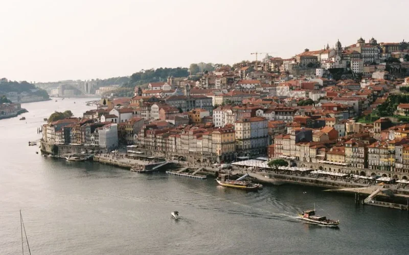Aerial view of Porto's charming riverside with historical architecture along the Douro River.