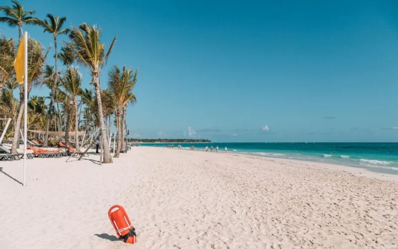 Explore the serene white sands and turquoise waters of Punta Cana's picturesque beach in the Dominican Republic.