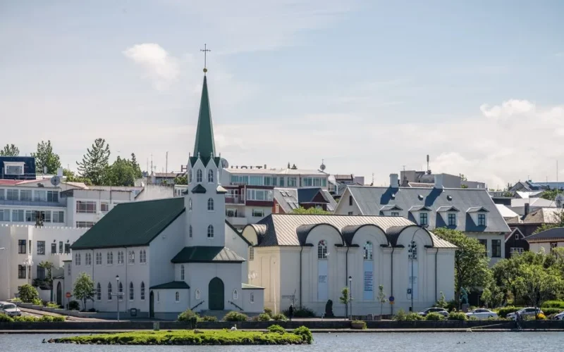 Beautiful church set against the backdrop of Reykjavik in summer.