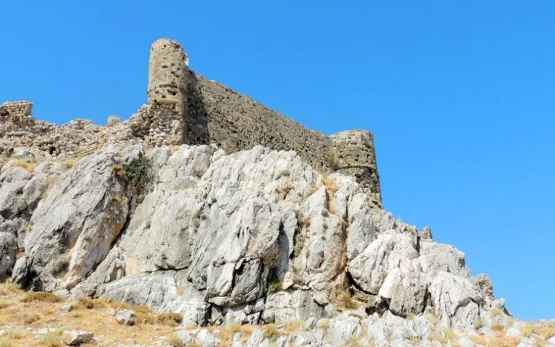 Explore the ancient ruins of Feraklos Castle on a sunny day in Rhodes, Greece.