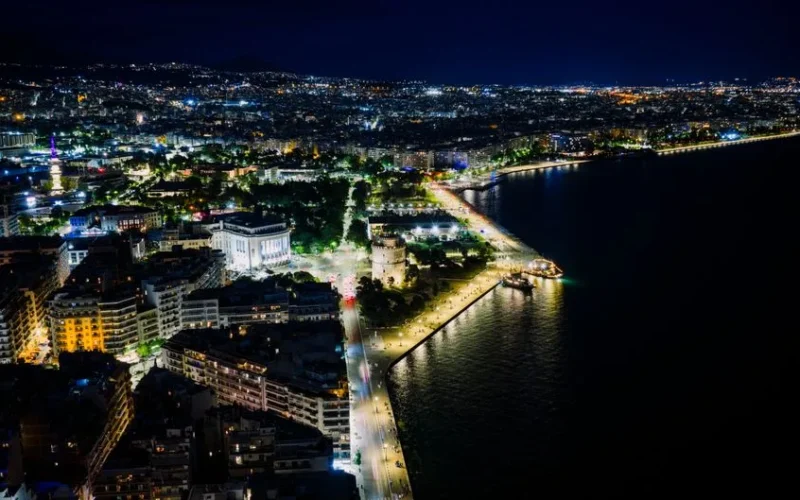 Stunning aerial night view of Thessaloniki's illuminated waterfront in Greece.
