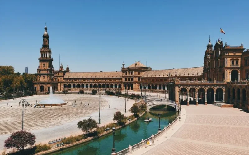 Stunning view of Plaza de España, Seville with its iconic architecture on a sunny day.