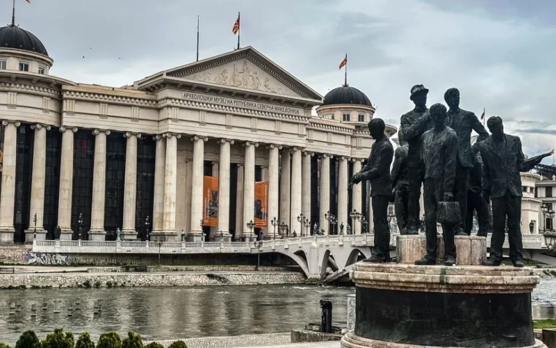View of the Archaeological Museum and historic statues in Skopje, North Macedonia.