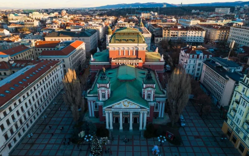 Stunning aerial view of Ivan Vazov National Theater and surrounding Sofia cityscape.