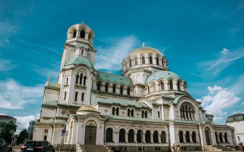 Majestic view of Alexander Nevsky Cathedral against a vibrant blue sky.