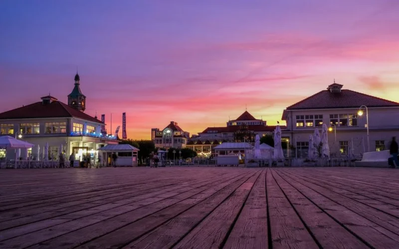 Captivating sunset at Sopot Pier, showcasing vibrant skies and historical architecture.