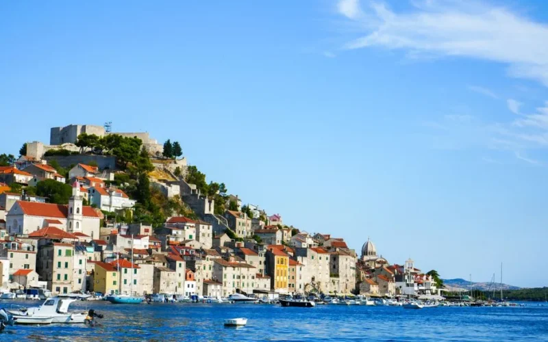 Explore the charming architecture and scenic beauty of Šibenik, Croatia from the waterfront.