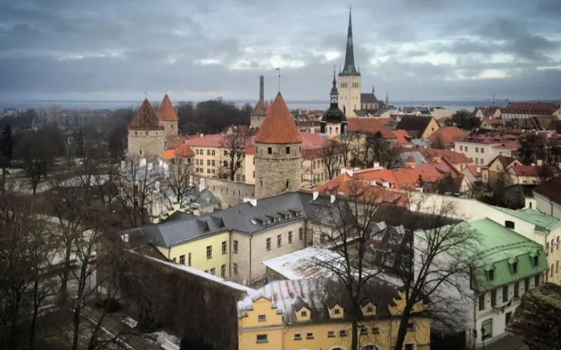A scenic aerial view of Tallinn's Old Town featuring historic architecture and medieval towers.