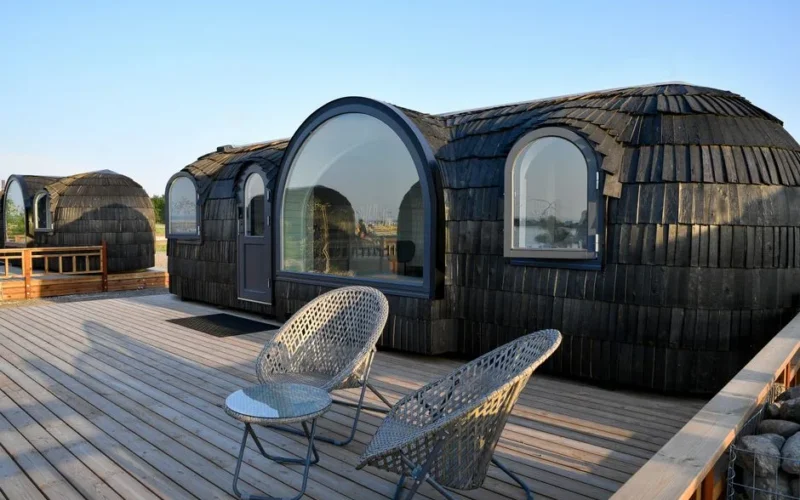 Eco-friendly glamping pods on a spacious wooden deck in Tallinn, Estonia. Perfect for a unique summer getaway.