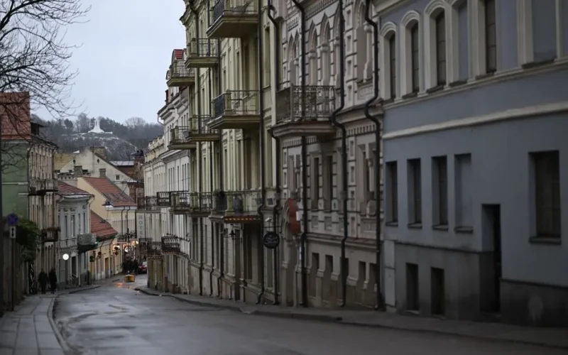 Elegant street view of historical townhouses in Vilnius' Old Town, Lithuania.