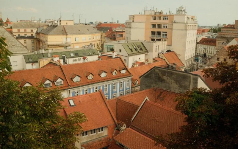 Capture the essence of Zagreb with a stunning view of traditional red-tile rooftops and historic buildings.