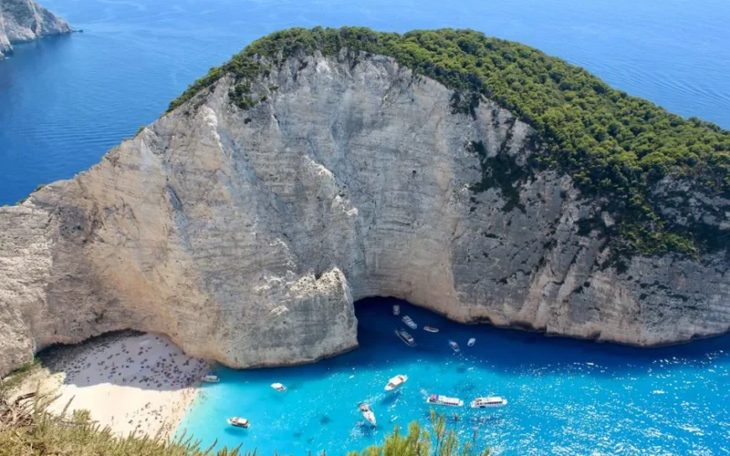 Stunning aerial view of Navagio Beach with turquoise waters and white cliffs in Zakinthos, Greece.